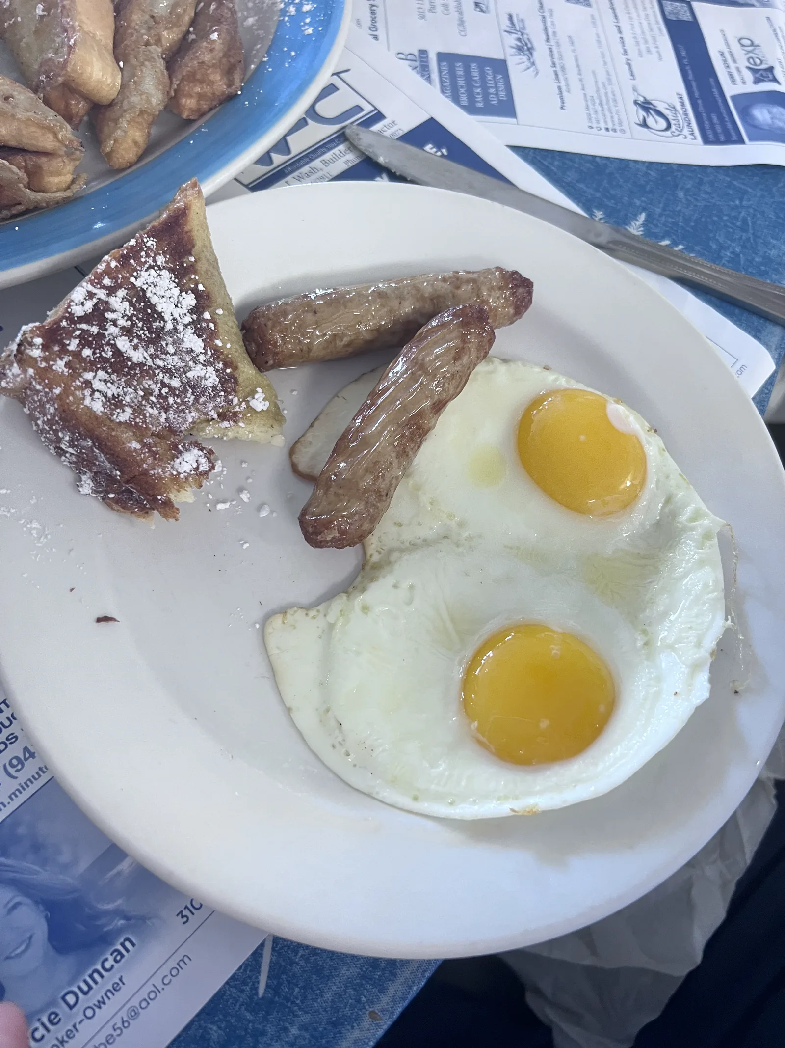 A classic Minnie’s breakfast with eggs, sausage, potatoes, and French toast.
